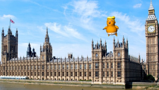 Mock up image of Trump Baby blimp flying over UK Parliament.