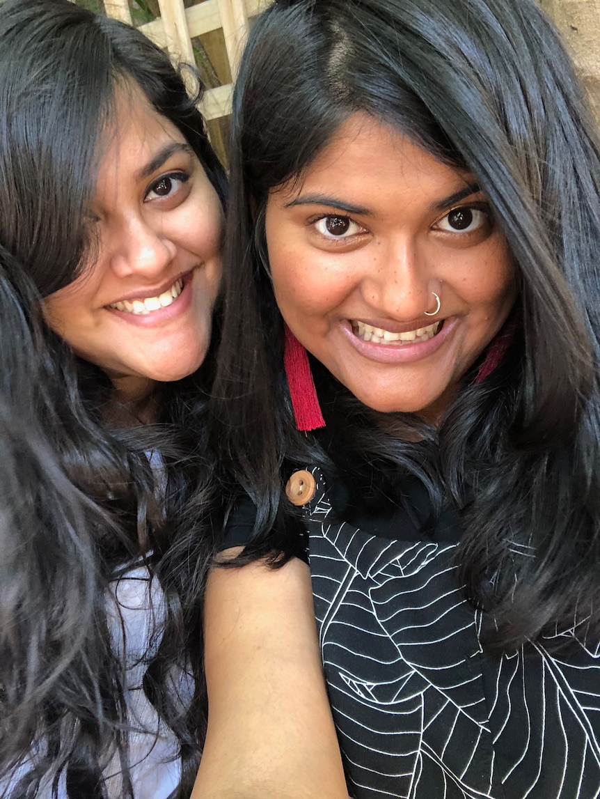 Two women smile in a selfie, for a story on choosing to get the AstraZeneca vaccine at 35.