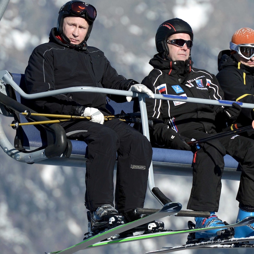 Vladimir Putin and Dmitry Medvedev ride in a ski cable car cabine near Sochi.