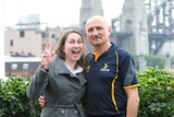 Elena Galiabovitch smiles and her dad Vlad strikes a serious pose in front of the Sydney Harbour Bridge.