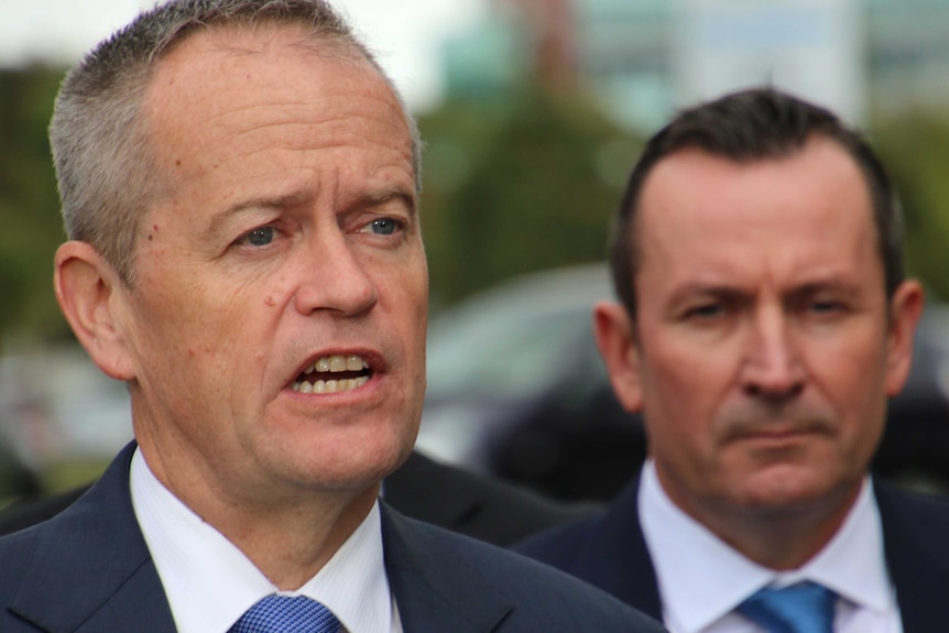 A close-up image of Federal Labor Leader Bill Shorten, with WA premier Mark McGowan behind him