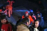 Rescue workers work at the scene of a magnitude 5.7 earthquake in eastern Turkey.