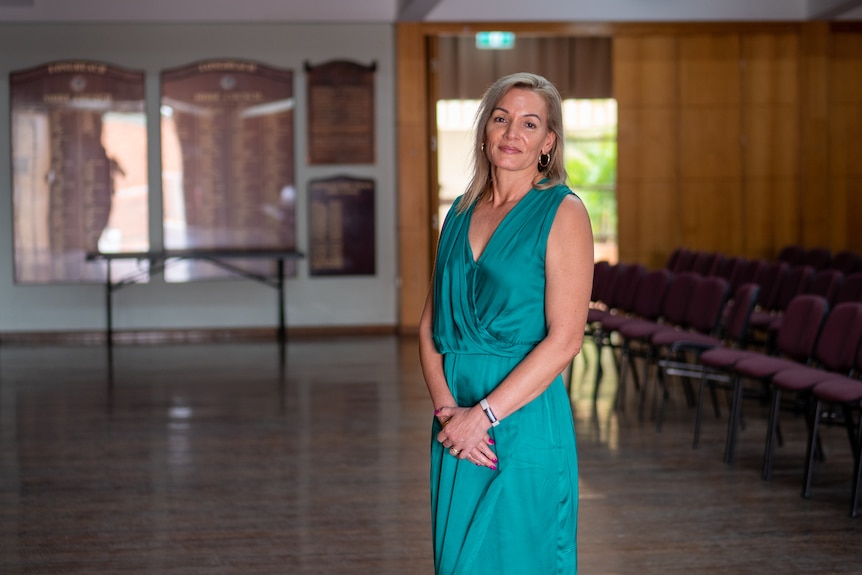 Longreach School of Distance education deputy principal Rachelle Moore in a green dress, Longreach November 2022.