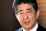 A close up of Shinzo Abe speaking
