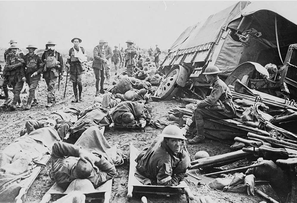 Wounded Australian soldiers wait on stretchers to be transported to a medical station in Belgium in WWI