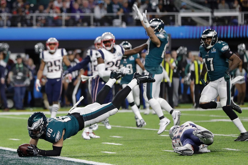 Philadelphia Eagles' Zach Ertz dives into the end zone for a touchdown in Super Bowl LII.