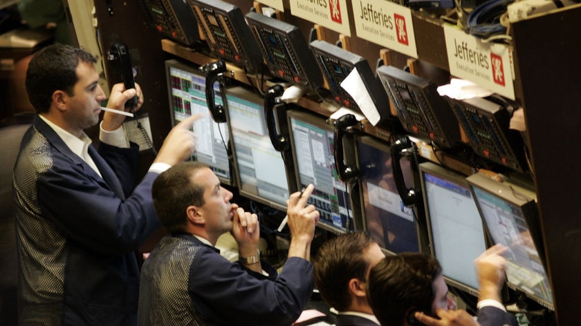 Traders work on the floor of the New York Stock Exchange