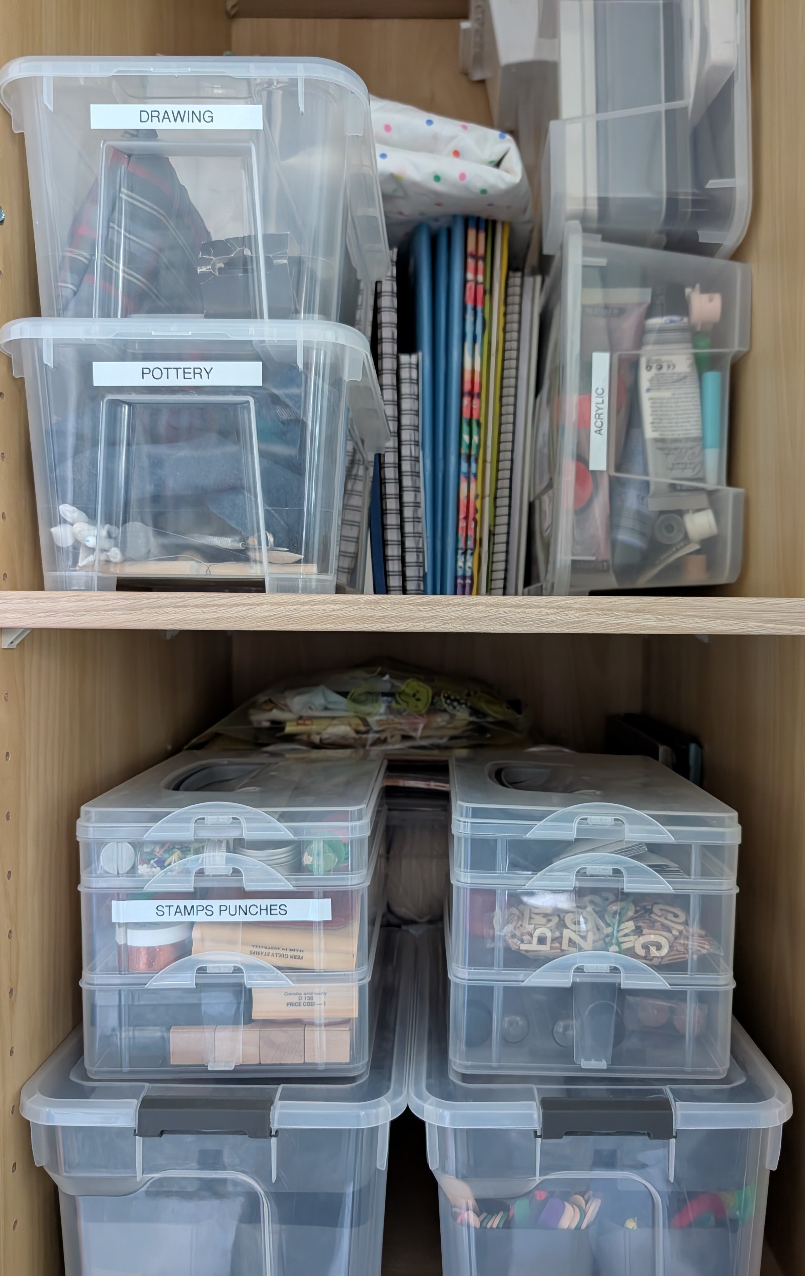 Image of clear labelled containers stacked on a shelf.