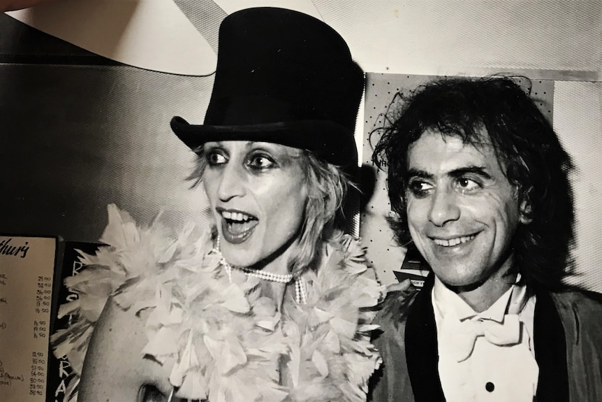 Black and white photo of Karvan's mum Gabrielle in a top hat and her stepdad Arthur wearing in a bow tie at a party