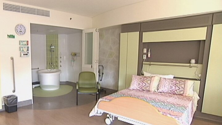 The spacious birthing room looks more like a hotel room than a hospital ward.