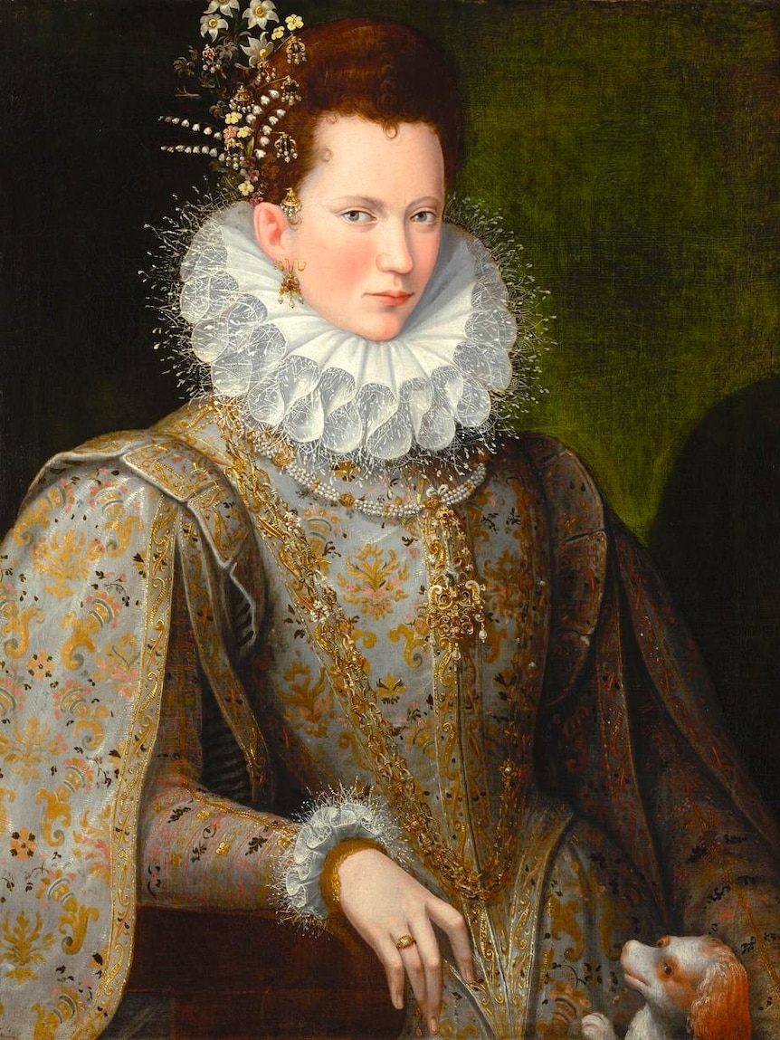 An ornate painting from 1590 of a serious noblewoman holding small dog