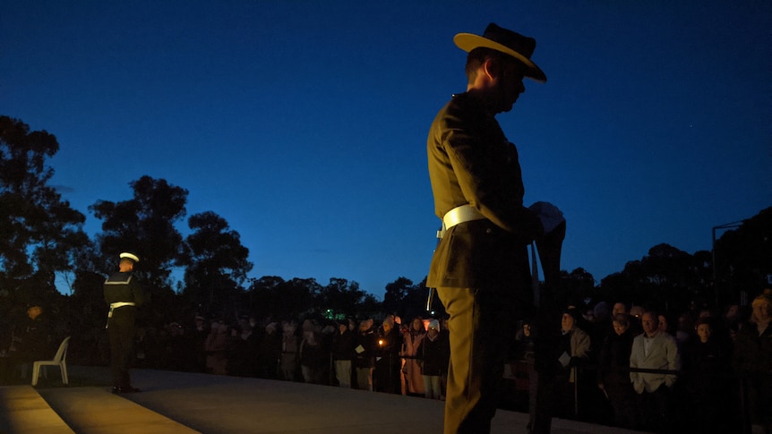 'Our strength is found in each other': Anzac Day services light up the dawn