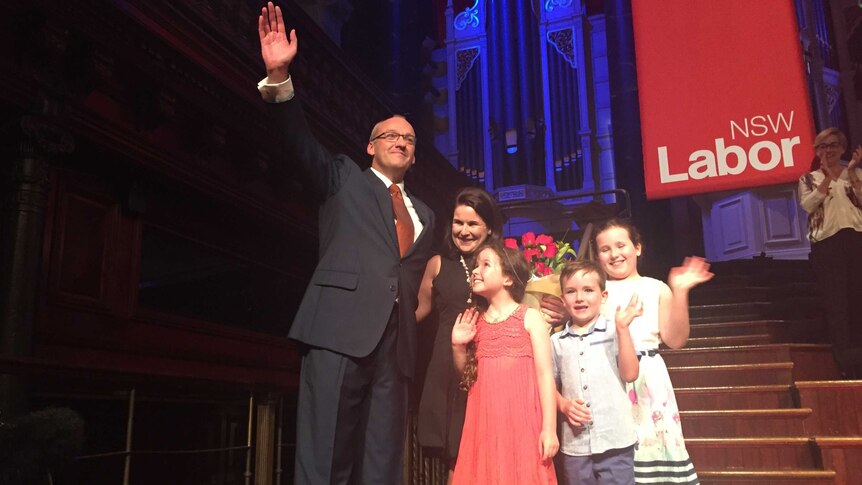 Mr Foley, his wife and three kids smile for the cameras.