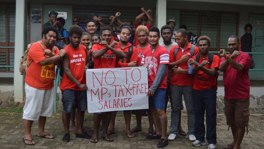 Solomon Islanders wear red to protest new MP entitlements