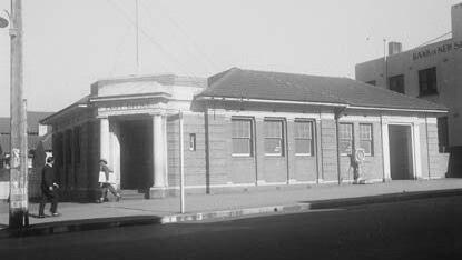 A black and white photo of a post office