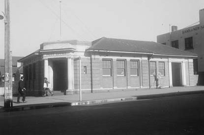 A black and white photo of a post office