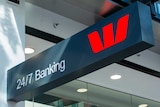 A sign that says 24/7 banking with a Westpac logo next to it.