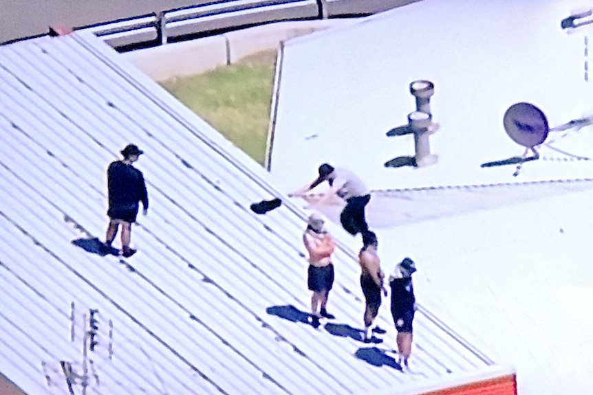 Detainees climb onto Malmsbury correction facility roof.