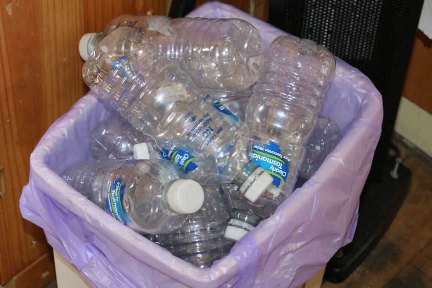 Bin full of empty plastic water bottles in Pioneer, Tasmania