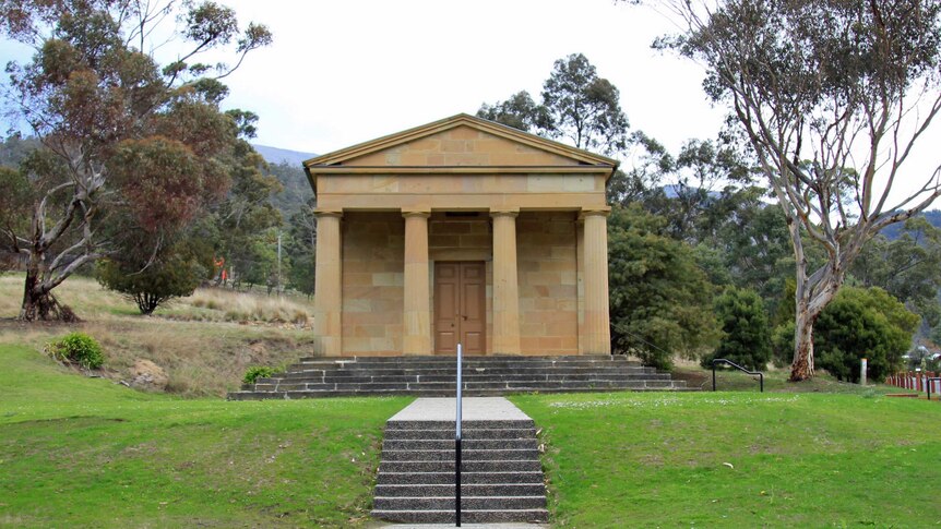 Sandstone building with four columns