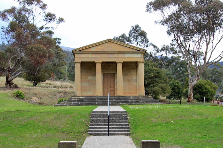 Sandstone building with four columns