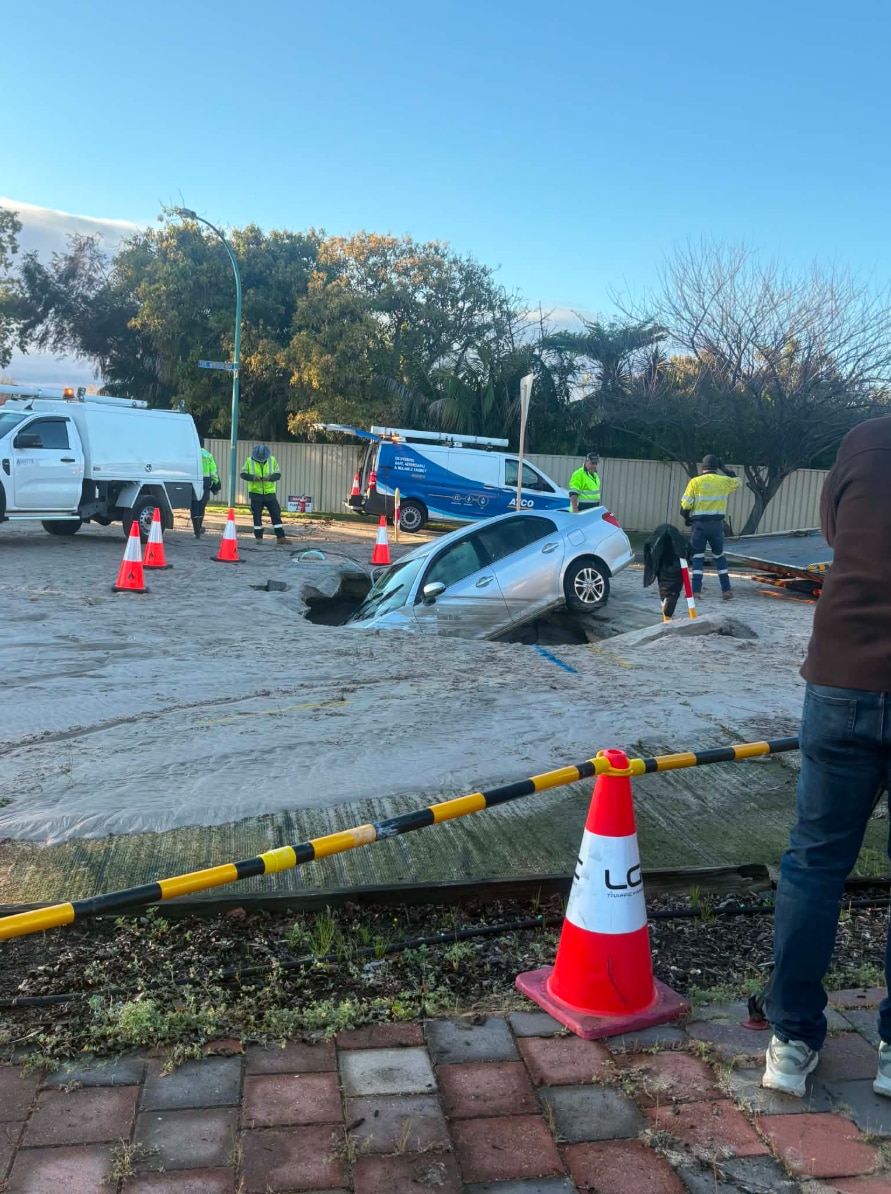 Car plunges into suburban sinkhole in Perth's south