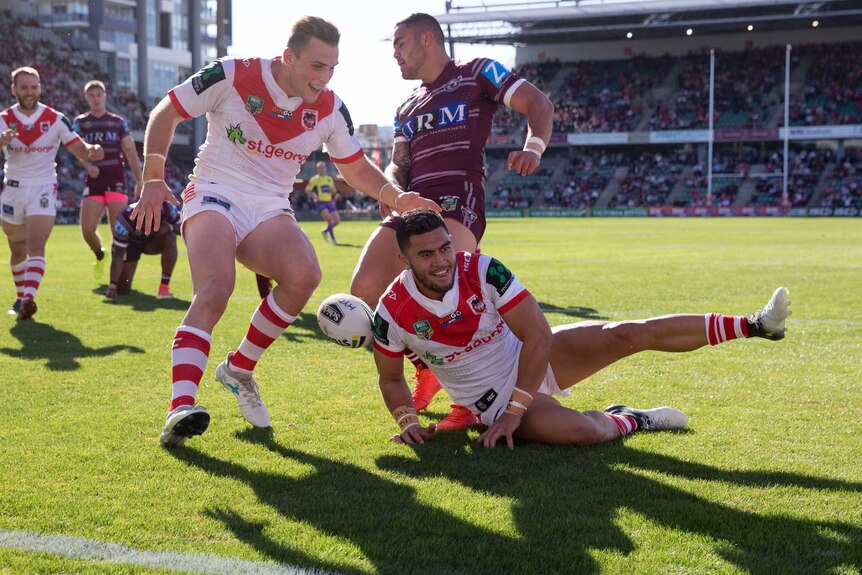 Timoteo Lafai slides over to score against Manly.