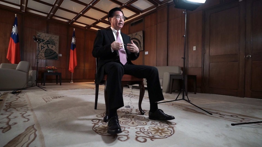 Taiwan's foreign minister Joseph Wu sits on a chair during an interview