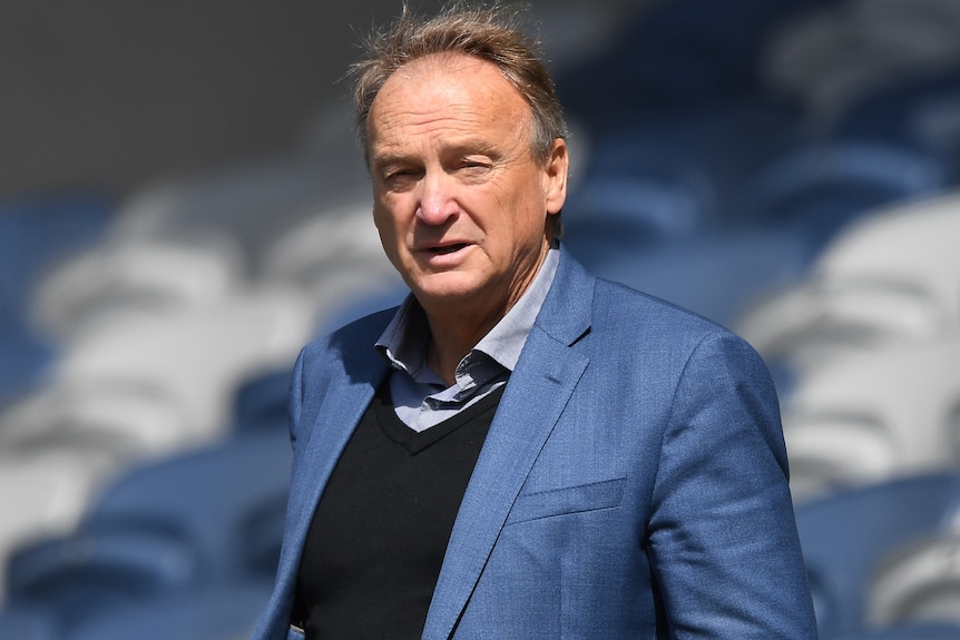 A photo of former Geelong Cats CEO Brian Cook standing at Kardinia Park in 2019.