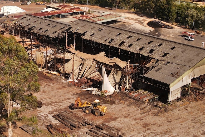 a birds-eye view of an old building with substantial damage after a fire.