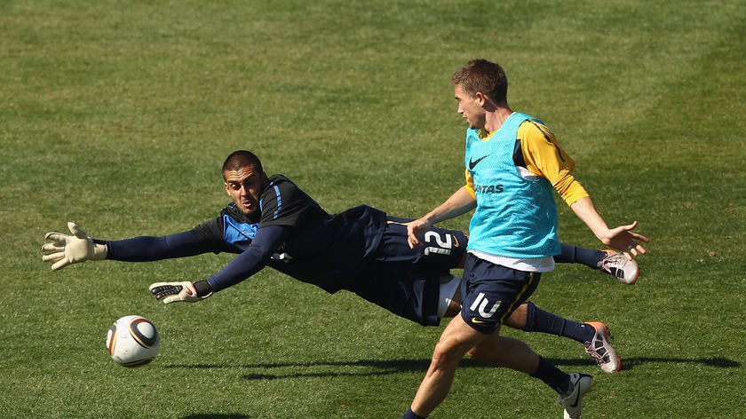 Moving freely: Harry Kewell tucks the ball past goalkeeper Adam Federici in training.