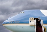President Barack Obama disembarks from Air Force One