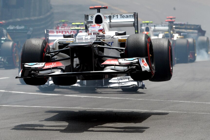 Sauber driver Kamui Kobayashi takes to the air in Monte Carlo.