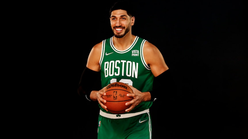 Boston Celtics Enes Kanter with a basketball in his hands smiling