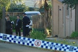 A house in Epping, NSW, where 5 bodies were found. Police tape in foreground.