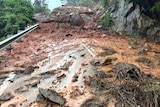 Heavy boulders have washed down across the Captain Cook Highway at Rex Lookout