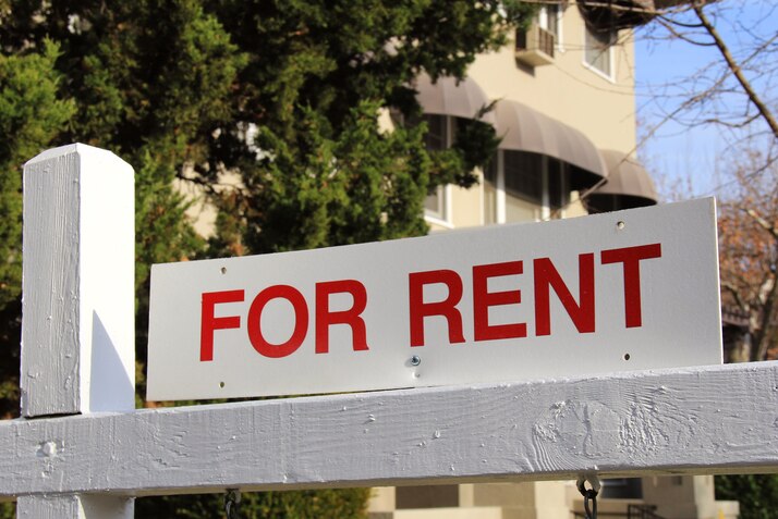 A For Rent sign outside a house