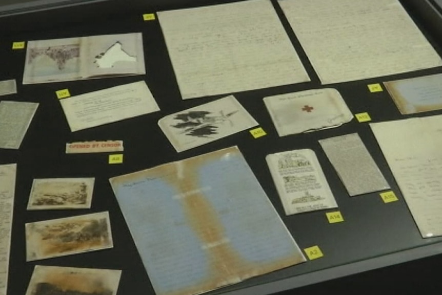 A collection of letters from the SS Gairsoppa shipwreck displayed on a table