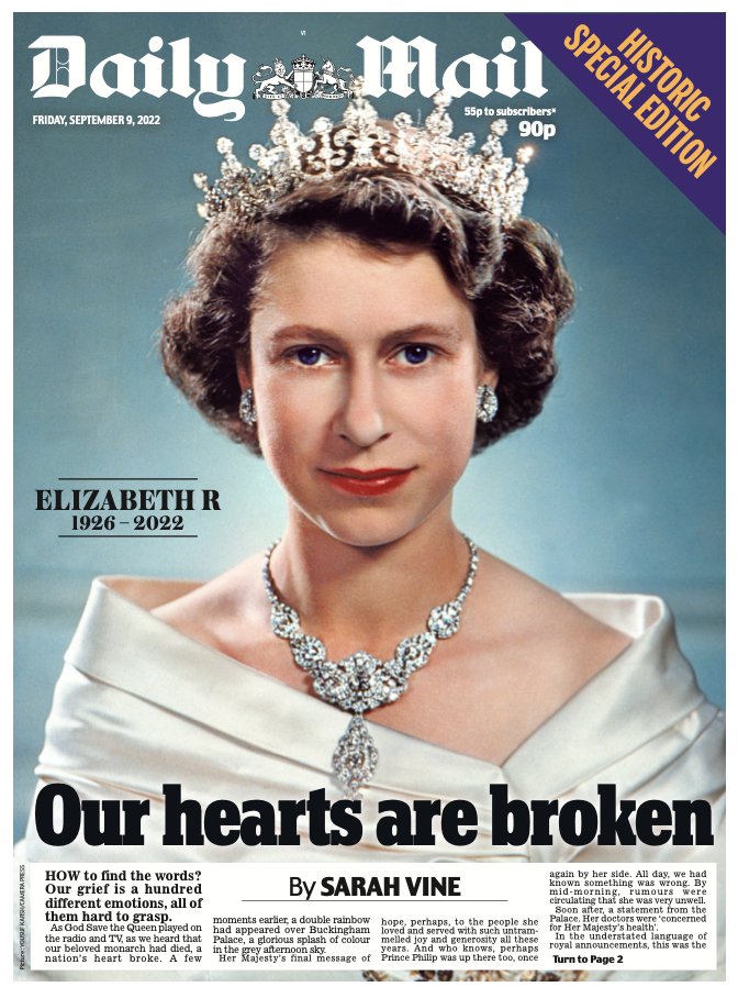 The Queen looks directly at the camera wearing a crown and a white dress.