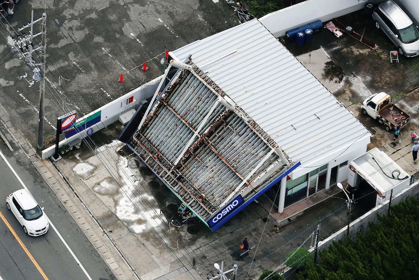 The rooftop of a gas station is collapsed after typhoon hit the area in Tateyama near Tokyo.