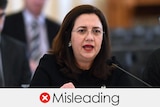 Annastacia Palaszczuk speaking in parliament. The verdict is "misleading" with a white cross in a red circle