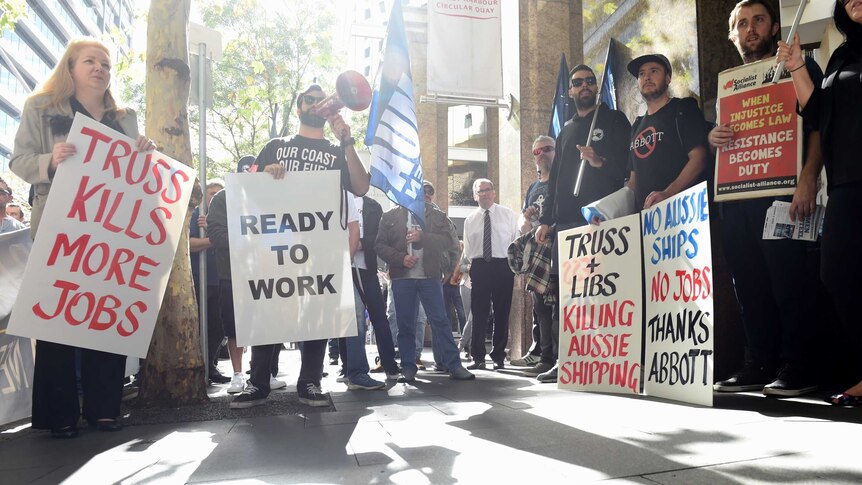 Demonstrators take part in a union protest in Sydney