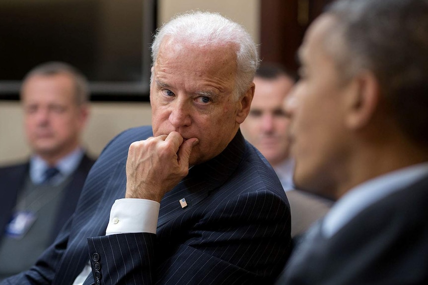 Joe Biden listens to Barack Obama during a meeting in the Situation Room
