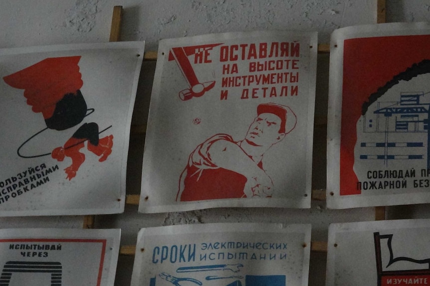 Old Soviet posters remain within the abandoned buildings at Pyramiden.