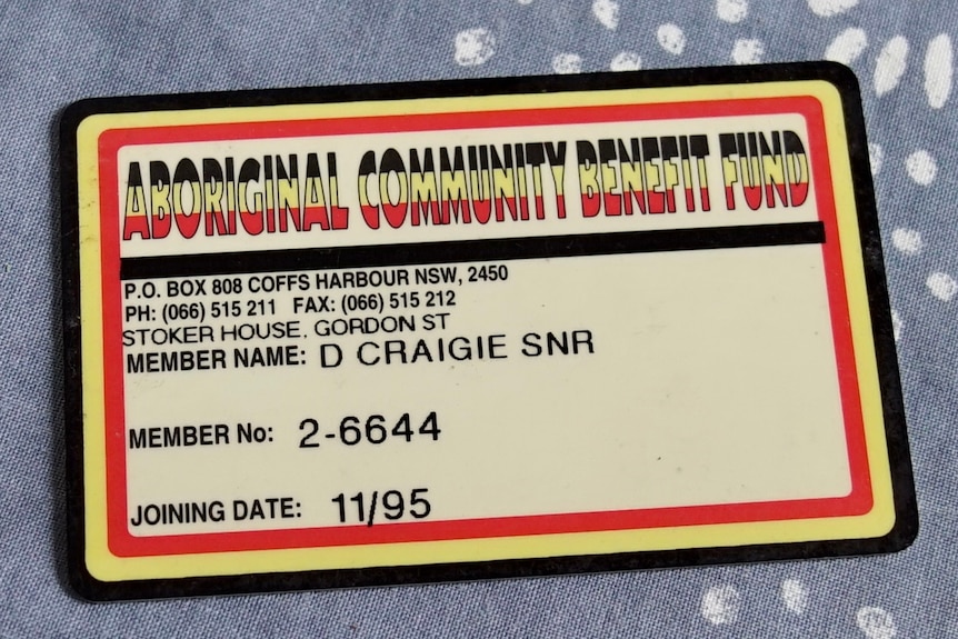 A membership card with 'Aboriginal Community Benefit Fund' written in red, yellow and black.
