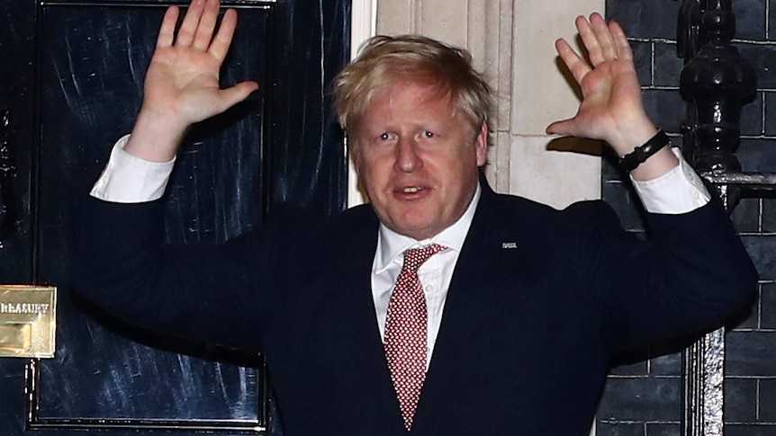 Britain's Prime Minister Boris Johnson applauds outside 10 Downing Street during the Clap For Our Carers campaign.