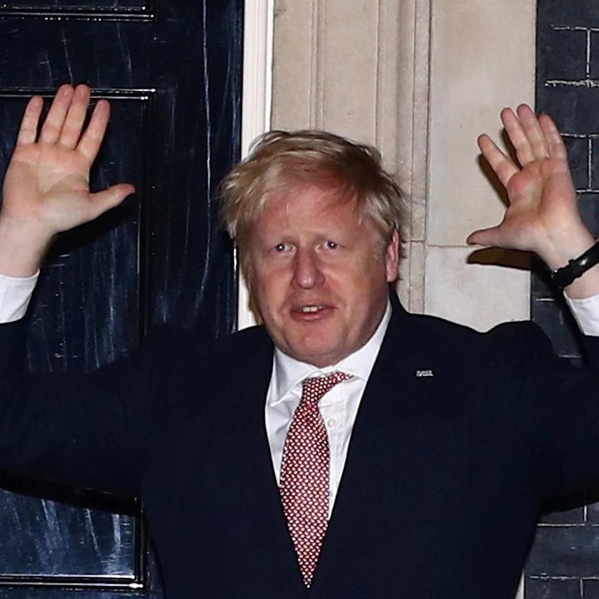 Britain's Prime Minister Boris Johnson applauds outside 10 Downing Street during the Clap For Our Carers campaign.
