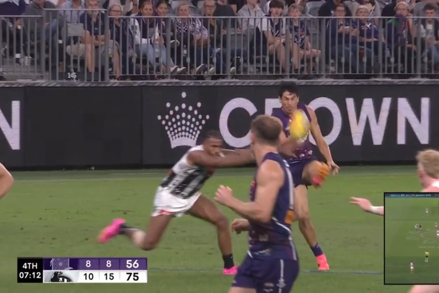 Isaac Quaynor reaching to block a Bailey Banfield snap kick