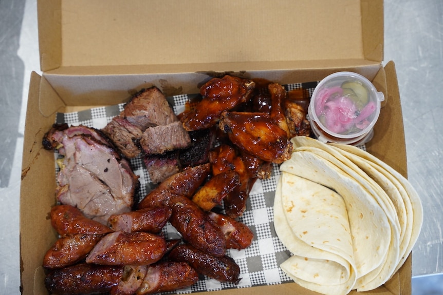 A box with brisket and tortillas