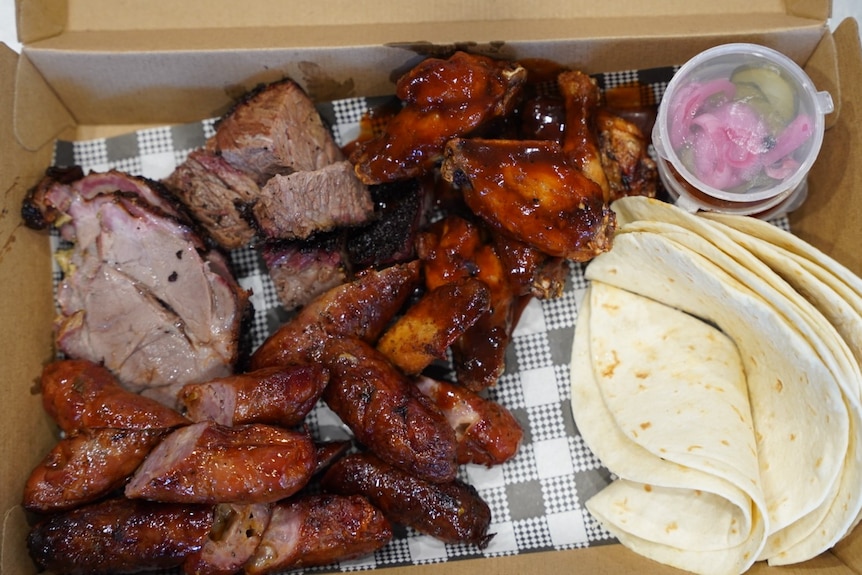 A box with brisket and tortillas